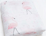 Folded two layer muslin gauze fabric with pink flamingo pattern .
