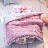 Soft cotton pink baby sleeping bed with a cute cartoon animal design, cozy padded sides, and colorful plush toys, creating a comfortable and playful.