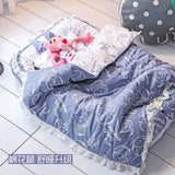 Soft cottonblue baby sleeping bed with a cute cartoon animal design, cozy padded sides, and colorful plush toys, creating a comfortable and playful.