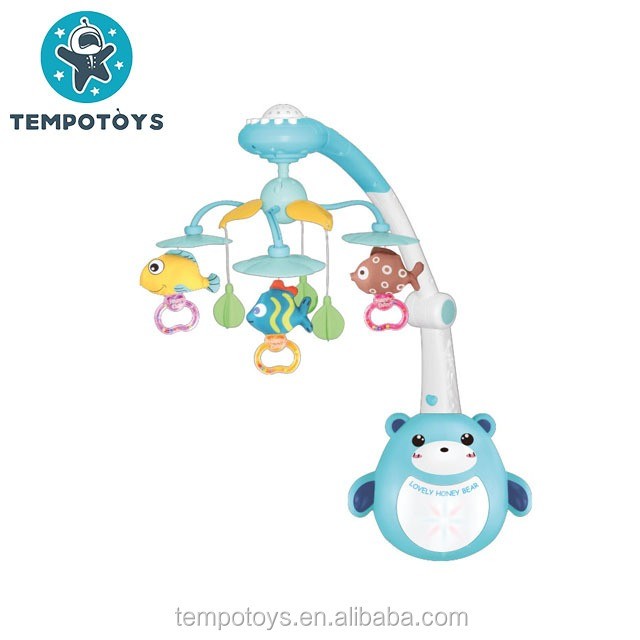 Baby bear bed bell toy with remote control, featuring fish and bear designs.