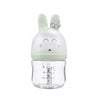Anti colic feeding bottle with a green bunny-shaped cap .
