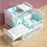 Children White crib with blue and white bedding set.