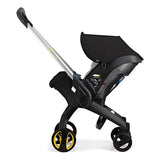 4 in 1 Black stroller with yellow wheels.