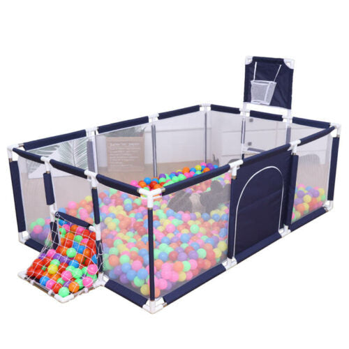 Children's portable playpen with colorful balls and basketball hoop .