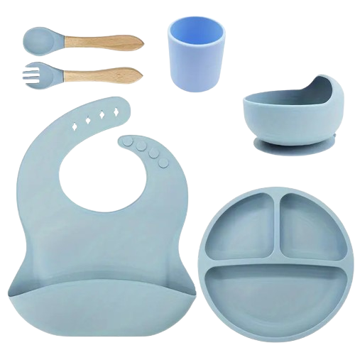 Set of blue silicone baby set including a bib, plate, cup, and spoons .