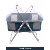 2 in 1 portable baby cot and bassinet Dark green baby crib with mesh sides .