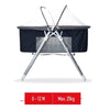 Portable blue baby cot and foldable bassinet with clear canopy .