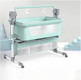 Mint green swing cot bedside baby crib with wheels .