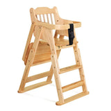 Wooden high chair with a black strap and portable folding high chair.