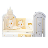 Children's crib with cartoon design and 'Good Dreams' themed bedding set