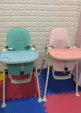 portable plastic feeding dining baby high chairs in pink and blue colours.