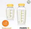 Two Medela breast milk storage bottles150 ml with yellow lids.