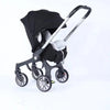 New 4-in-1 black and silver multifunctional baby stroller and carriage with a portable bassinet basket, designed as a versatile travel system for newborns and growing babies.