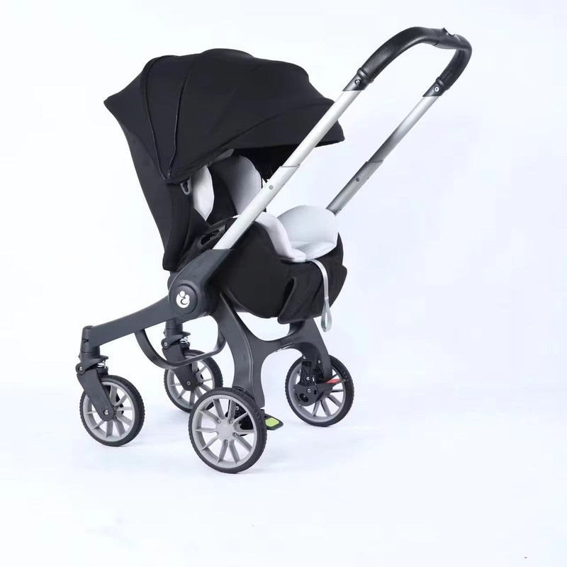 New 4-in-1 black and silver multifunctional baby stroller and carriage with a portable bassinet basket, designed as a versatile travel system for newborns and growing babies.