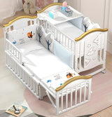 White crib with gold accents and cartoon designs bedding set.