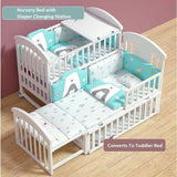 white baby cot bed with convertiblebedding set.