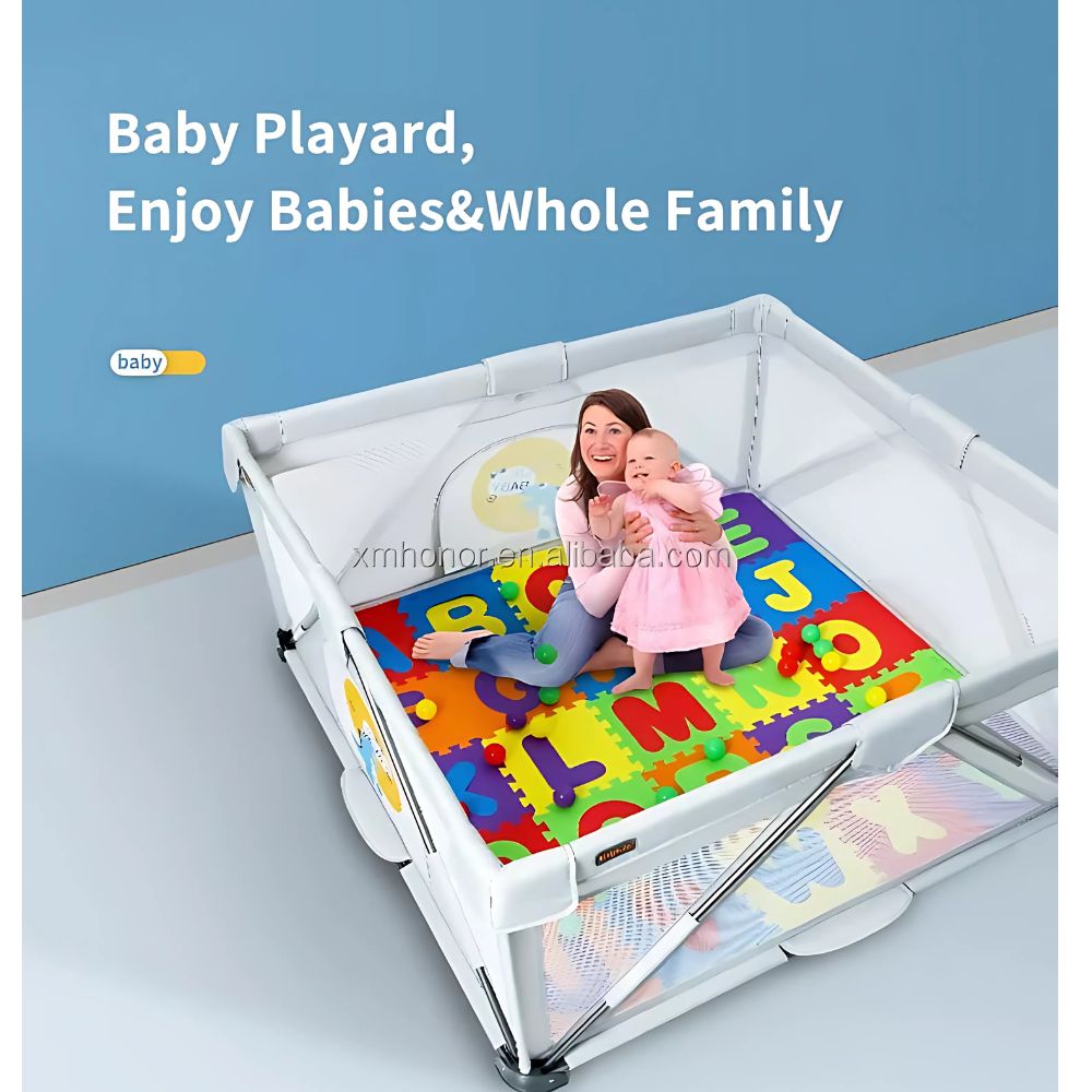 Baby playpen with colorful alphabet mat and a child playing on it.