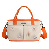 Beige and orangeDiaper bag with cartoon character patches -Tote mummy handbag.