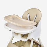 Beige and whitefoldable high chair.
