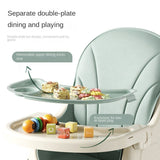  Foldable Baby high chair with separate double-plate design for dining and playing, featuring food and toys.