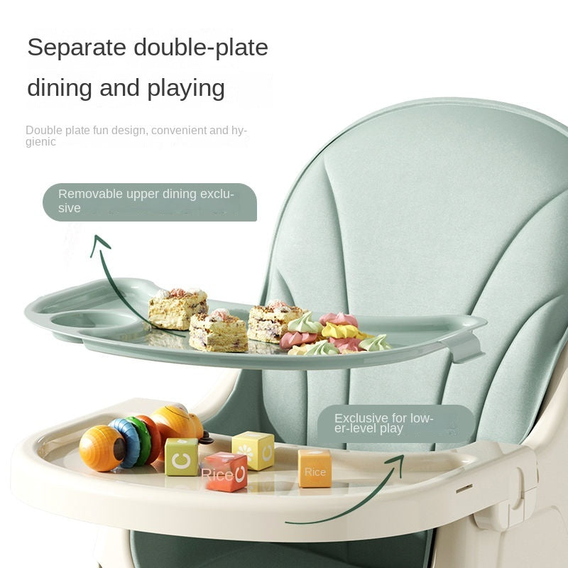  Foldable Baby high chair with separate double-plate design for dining and playing, featuring food and toys.