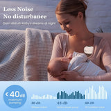 Woman breastfeeding a baby with double wearable breast pump.