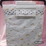 Baby blanket with star and moon pattern.
