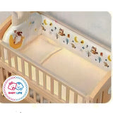 Baby crib with bedding set and a decorative bumper and 'Baby Life' logo.
