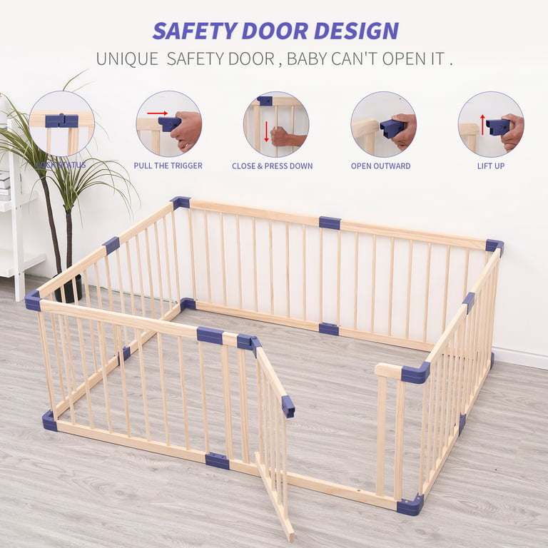 Wooden foldable playpen with safety features on a light wood floor.