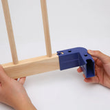 Blue corner connector being used on wooden playpen frames