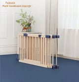  Wooden foldable playpen with blue accents in a bright room .
