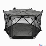 Black hexagonal MagicGo baby playpen with mesh sides, a padded floor, and a sturdy support frame.
