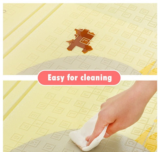 Yellow high-quality baby floor mat with a hand cleaning the surface and the text “Easy for cleaning” displayed.