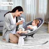 Woman interacting with a baby in an electric baby bouncer.