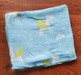 Cotton swaddle wrap with unicorn pattern .