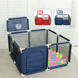 Navy blue playpen with colorful balls and basketball hoop accessories .