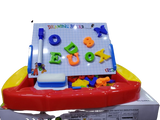 Children's magnetic drawing board with letters and numbers .