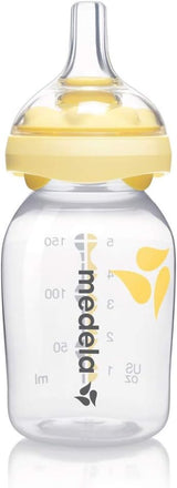 Medela baby bottle with yellow cap 