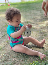  Meli Cat-shaped snack bowl in a babyplaying with it.