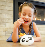 Girl eating in a panda-shaped Meli bowl