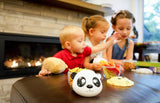 Children sitting at a table with food panda shaped Meli bowl.