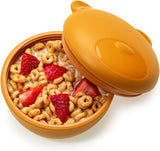Cereal bowl with strawberries in a Melii silicone bowl with lid