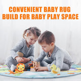 Two children playing on a colorful soft crawling mat with toys.