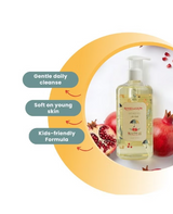 Bottle of roots & Glow shower gel with pomegranate elements .