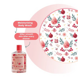 Bottle of moisturizing Roots and Glow body wash with a decorative pink plate featuring pomegranate design.