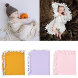 Collage of a baby in various poses with a textured blanket and colorful pom-pom blankets.