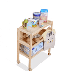 Wooden foldable bedside baby changing table with supplies .
