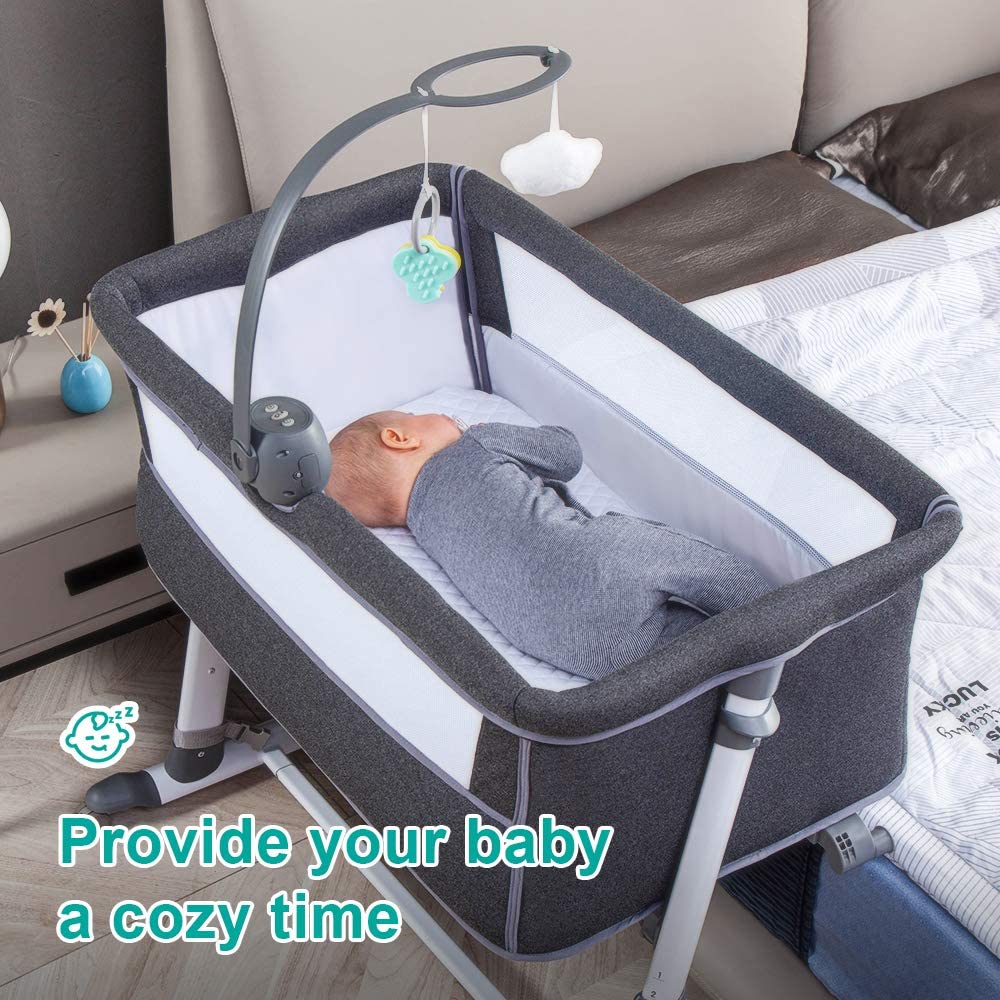 Baby in a gray bedside bassinet with a cozy atmosphere, text 'Provide your baby a cozy time'.