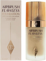 Charlotte Tilbury Airbrush Flawless Foundation bottle next to its beige and gold packaging box, featuring the brand's signature diamond logo.