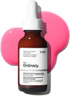 The Ordinary soothing and barrier support serum bottle with a pink .
